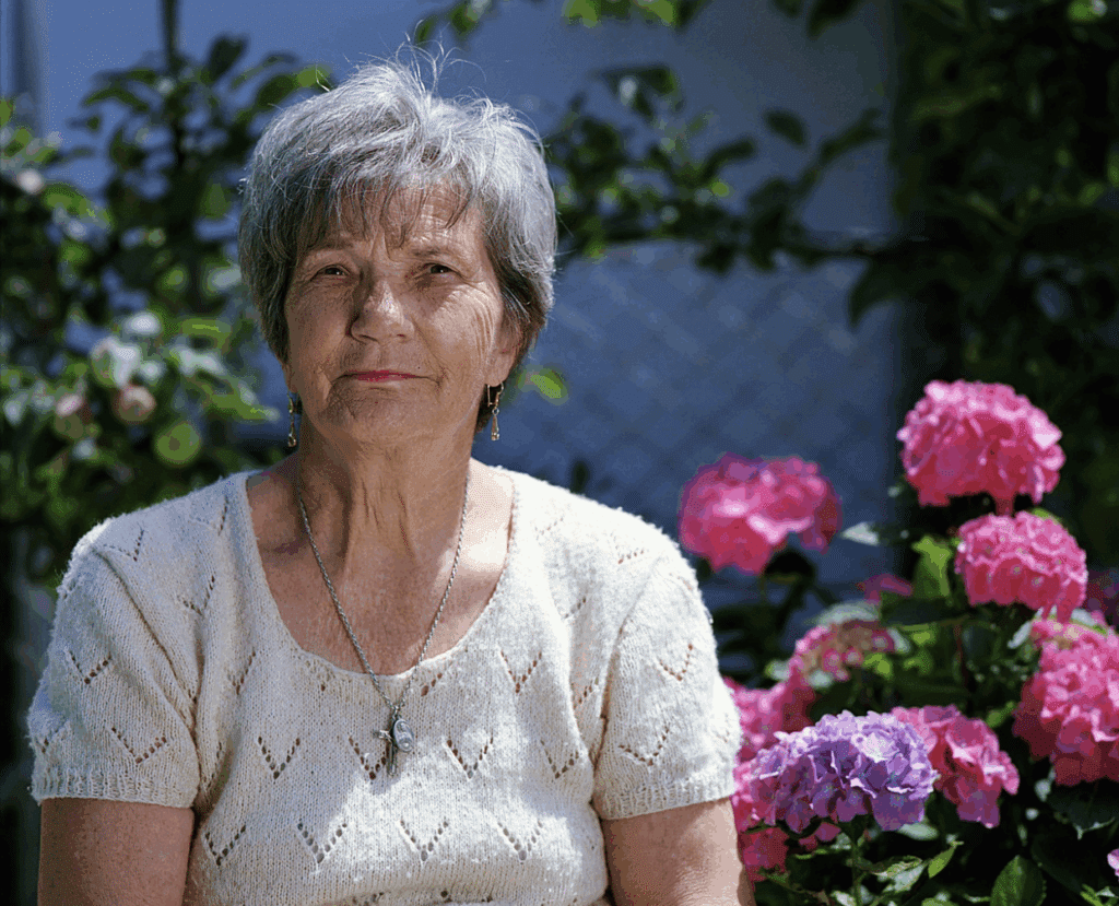 A woman enjoying the garden at memory care