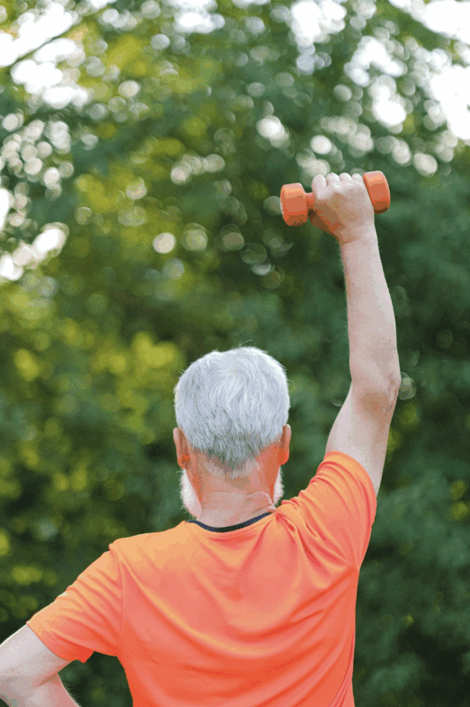 A senior lifting weights for rehab exercises