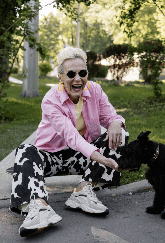 A senior woman enjoying a therapy dog