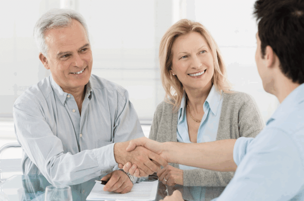 A senior couple meeting with a representative of our healthcare center