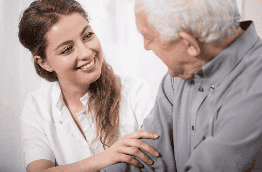 A nurse talking with senior citizen