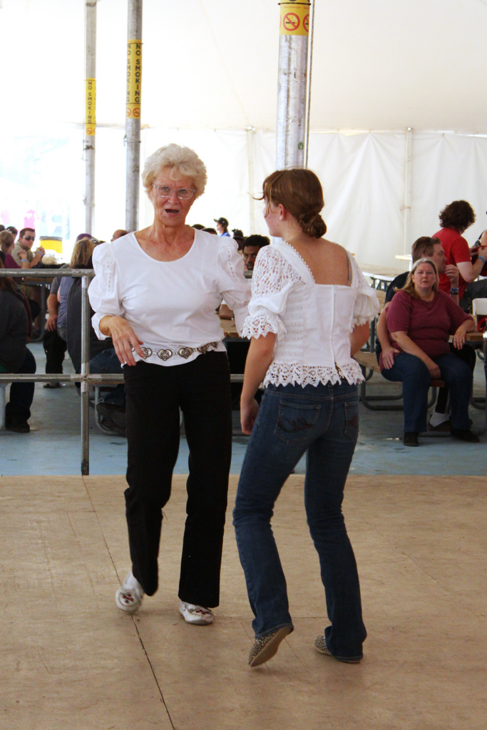 Senior dancing at a county fair.