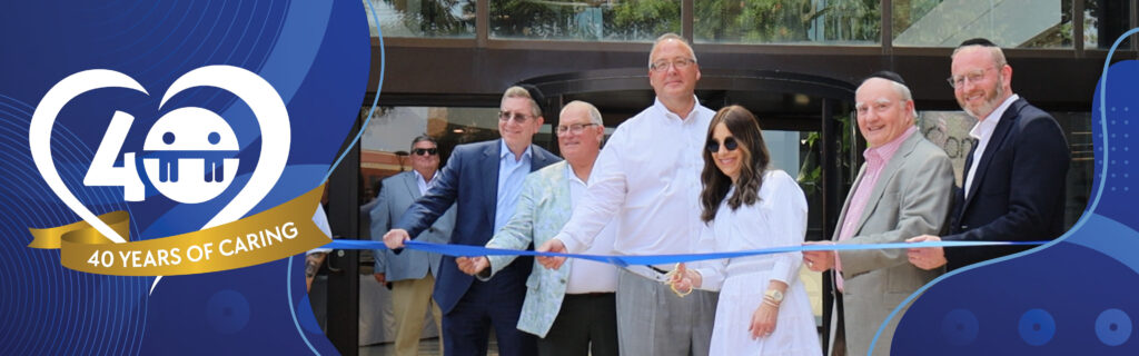 A picture of CommuniCare corporate leadership cutting the ribbon at their new corporate headquarters overlaid with a badge that reads "40 Years of Caring."