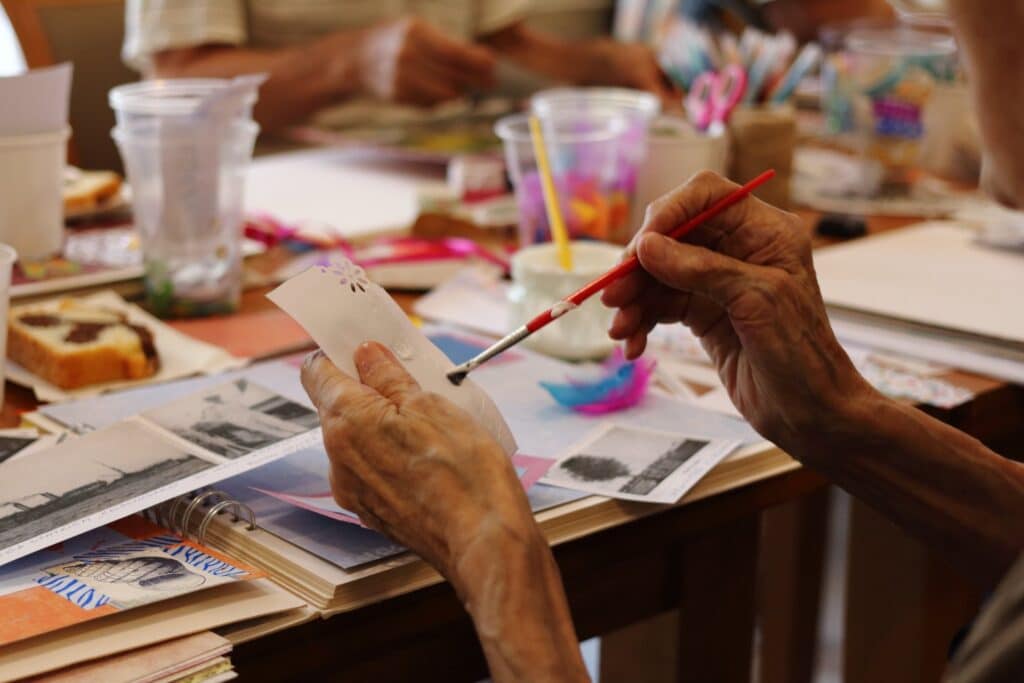Senior painting as occupational therapy.